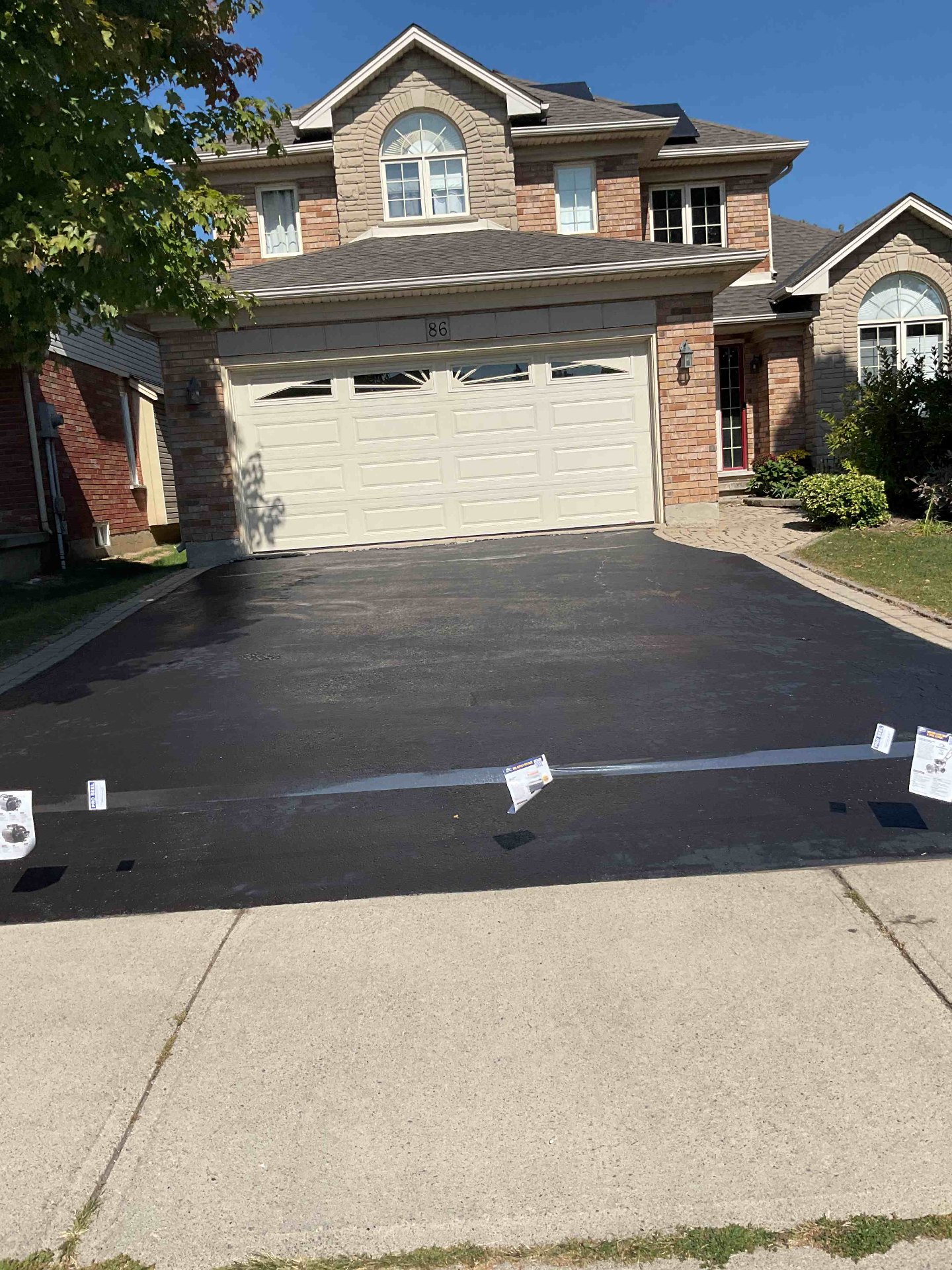 Restored large driveway in Burlington after professional sealcoating by Pro Seel
