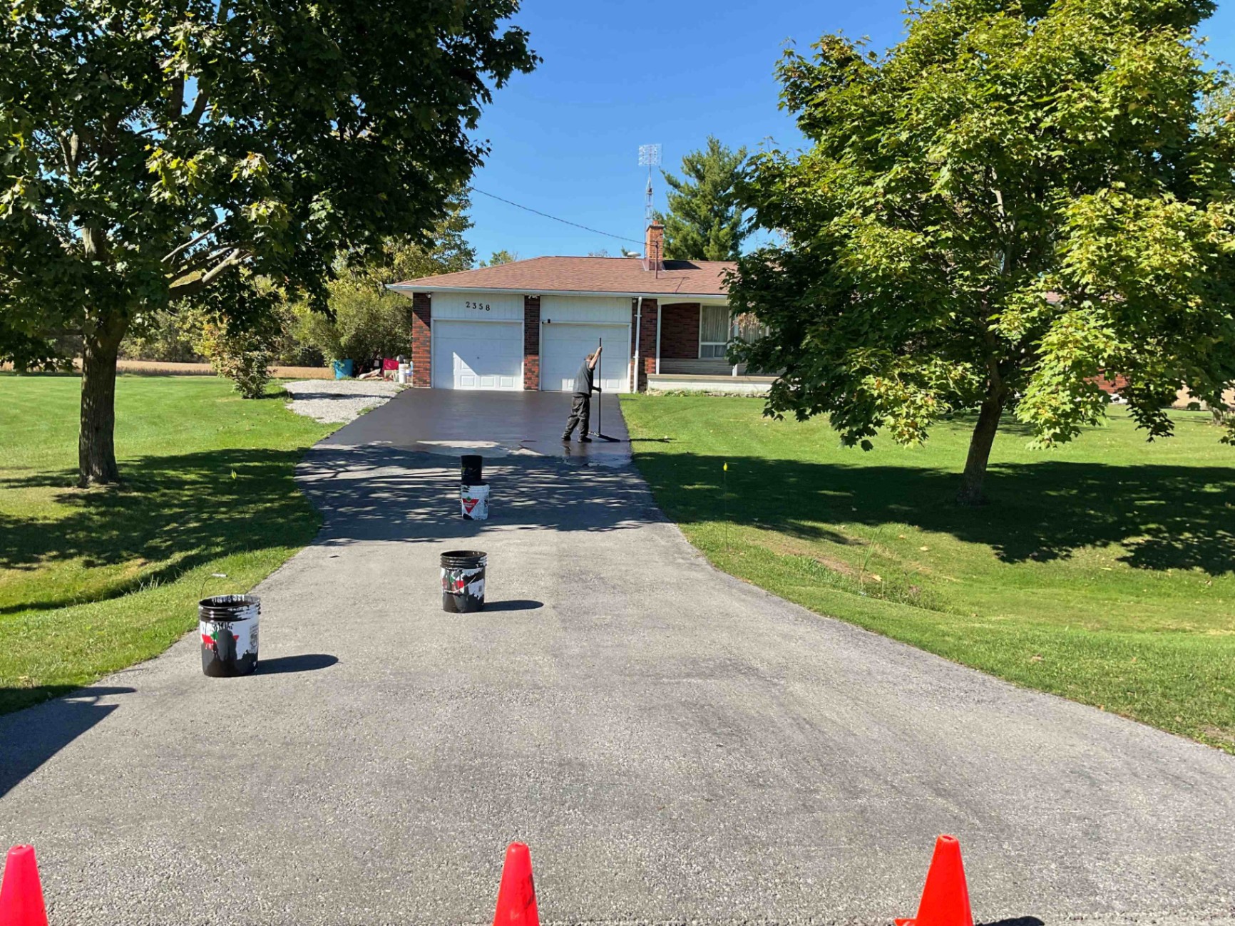 Cracked rural driveway in Caledonia before asphalt crack repair and sealing