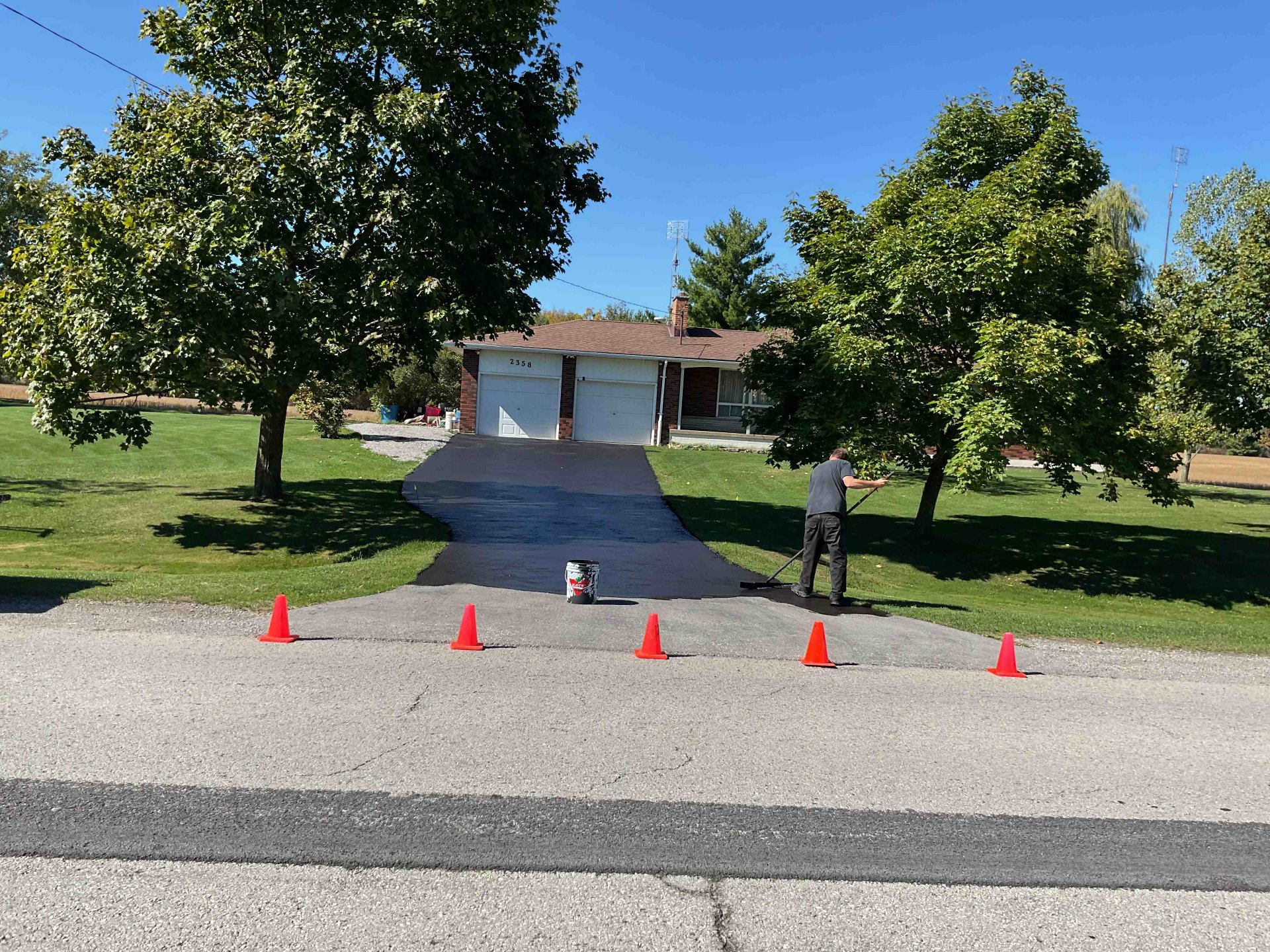 Smooth, sealed rural driveway in Caledonia after Pro Seel asphalt restoration